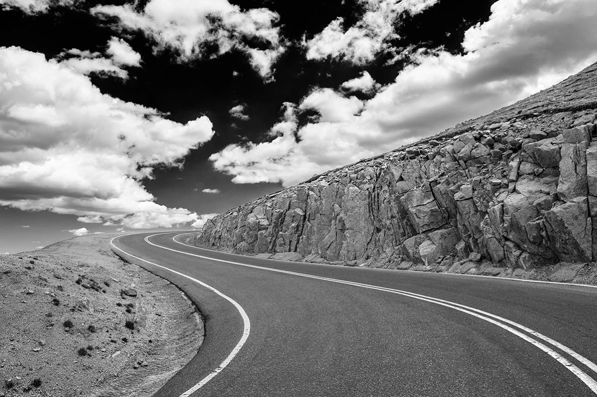 Black-and-white study of the winding Pikes Peak Highway, Colorado