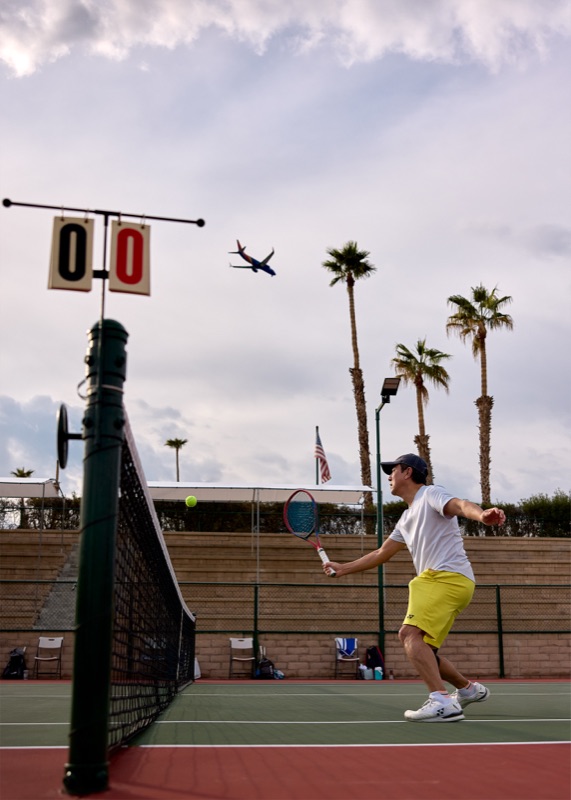 A rally at CC Tennis Club as a plane descends toward Palm Springs International (PSP)